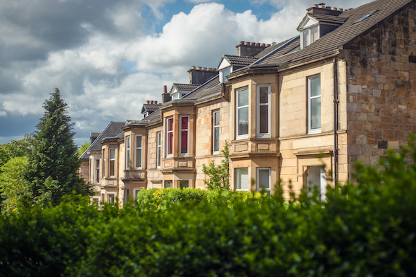 Blonde,Sandstone,Terraced,Homes,On,A,Tree,Lined,Street,In